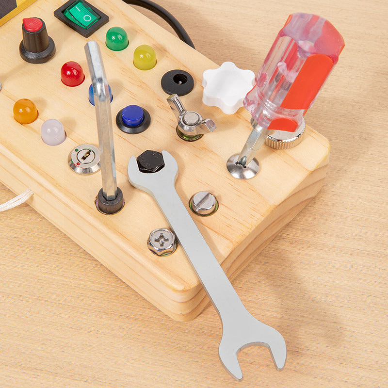 Wooden LED Busy Board Creative Toys, A close-up of a toddler's hand toggling a colorful switch on an illuminated wooden sensory toy